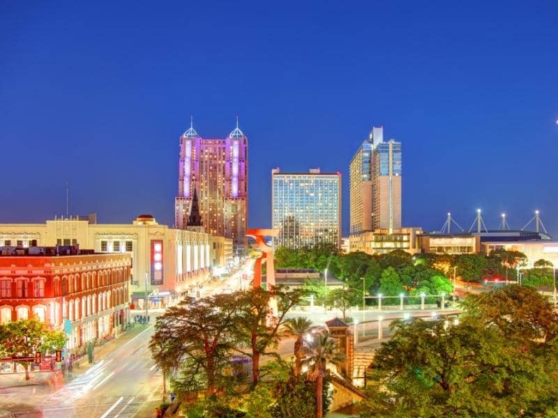 Downtown San Antonio, Texas night skyline with commercial buildings, transportation corridors, and urban development areas relevant to land surveying and site planning